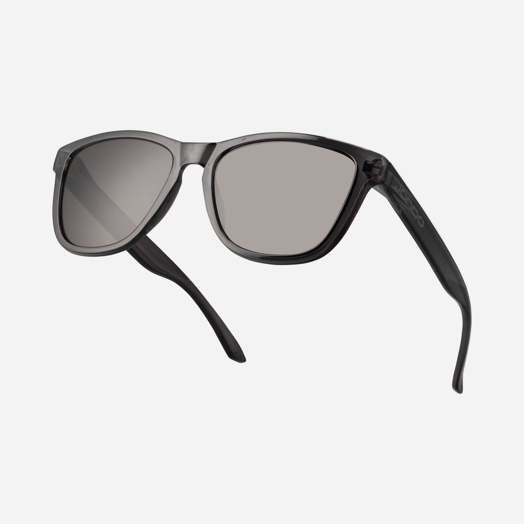 Fringe Golf sunglasses in gray frame with light gray lenses, angled view