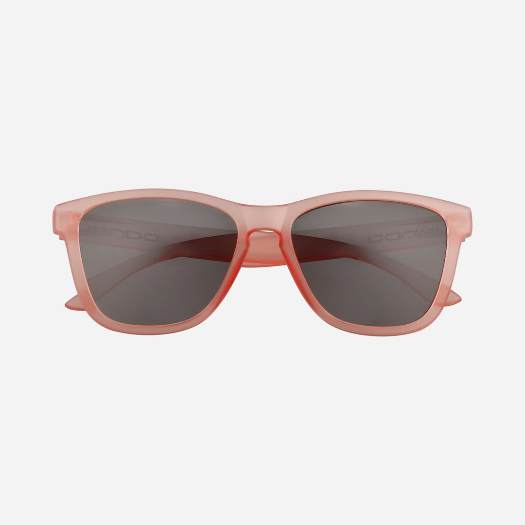 Fringe Golf sunglasses with rose frame and dark lenses, front view