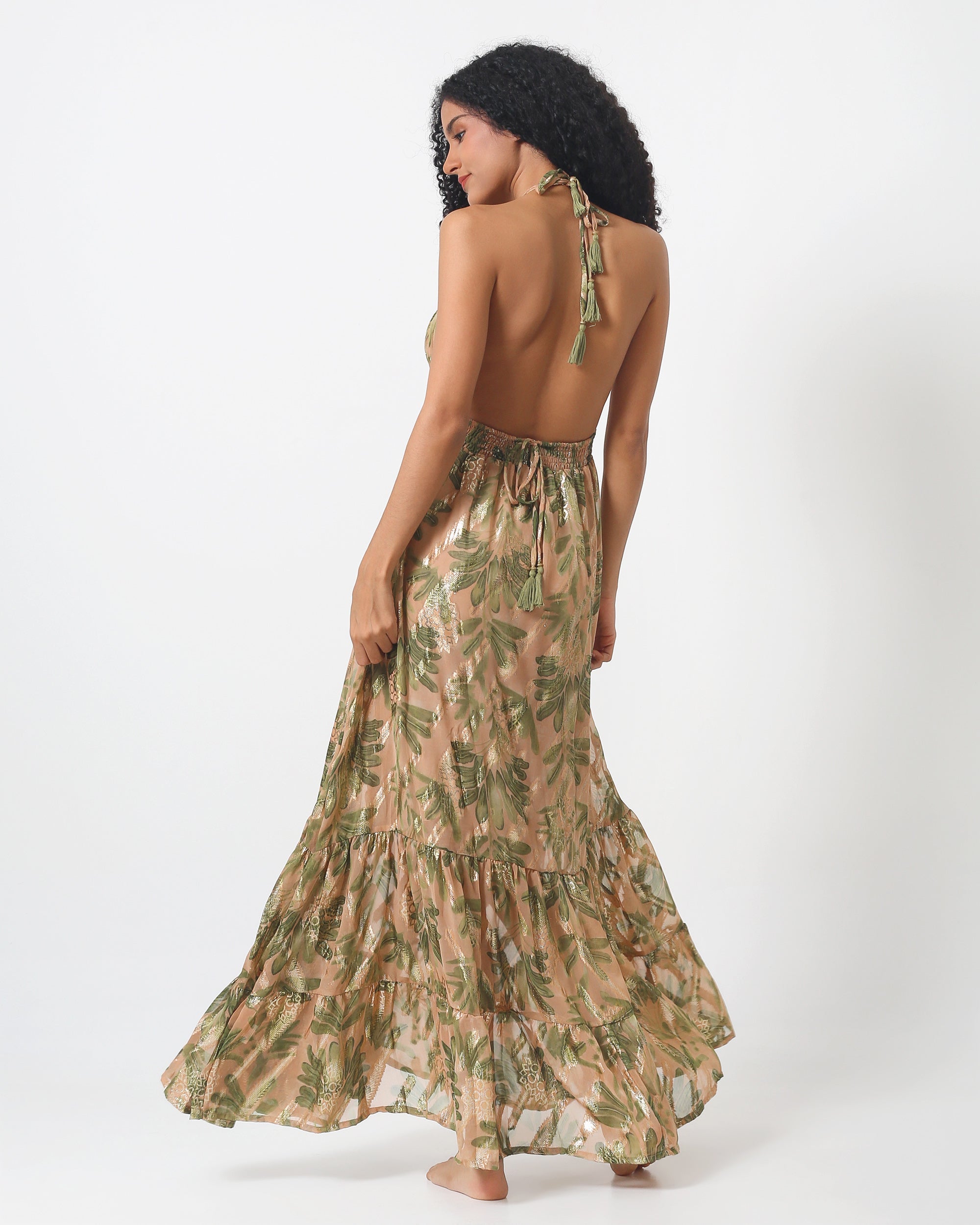 Lima Dress with open back, halter straps, tiered ruffle hem, green leaf print