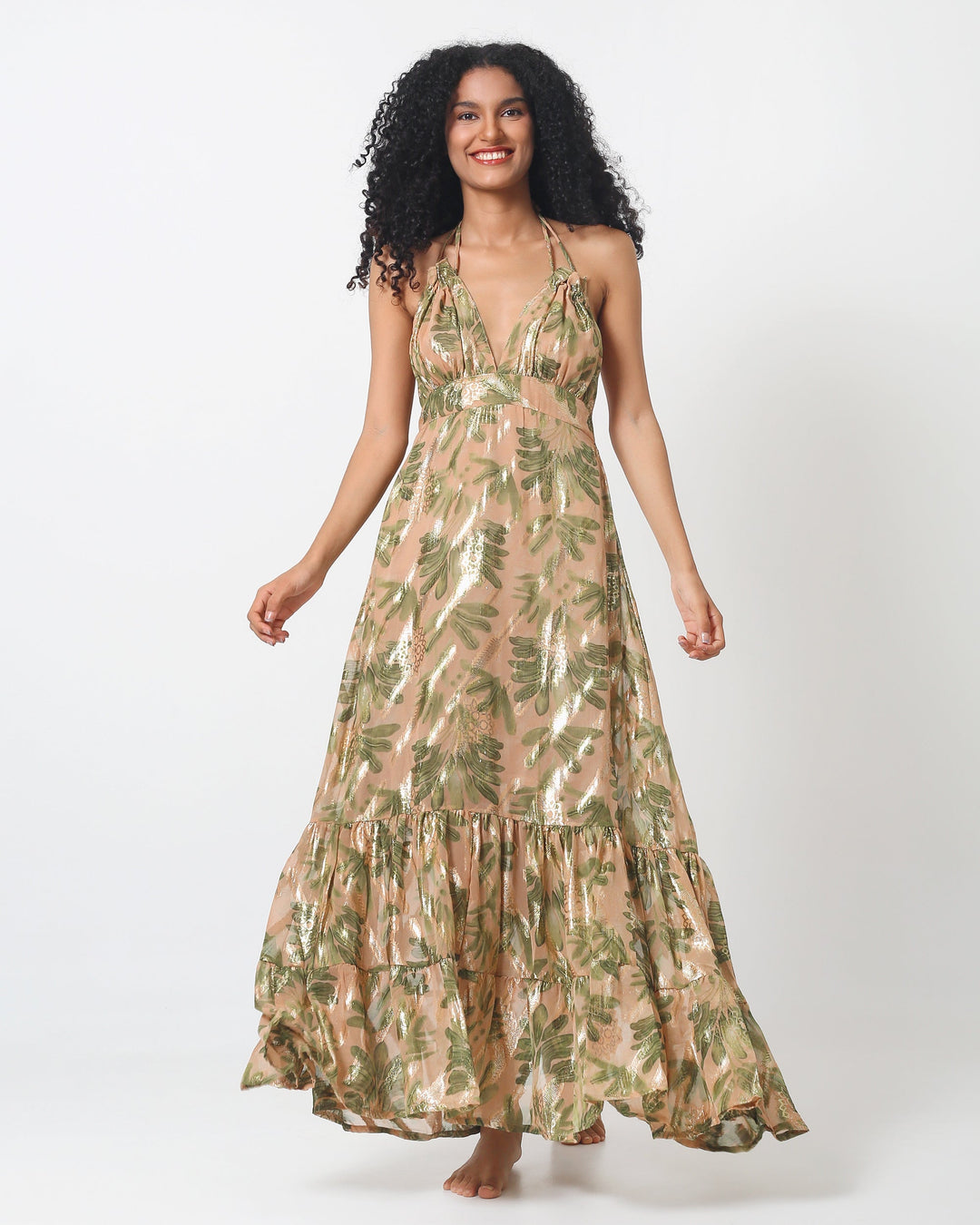Lima Dress front view: halter neckline, layered tiered skirt, green and tan leaf print