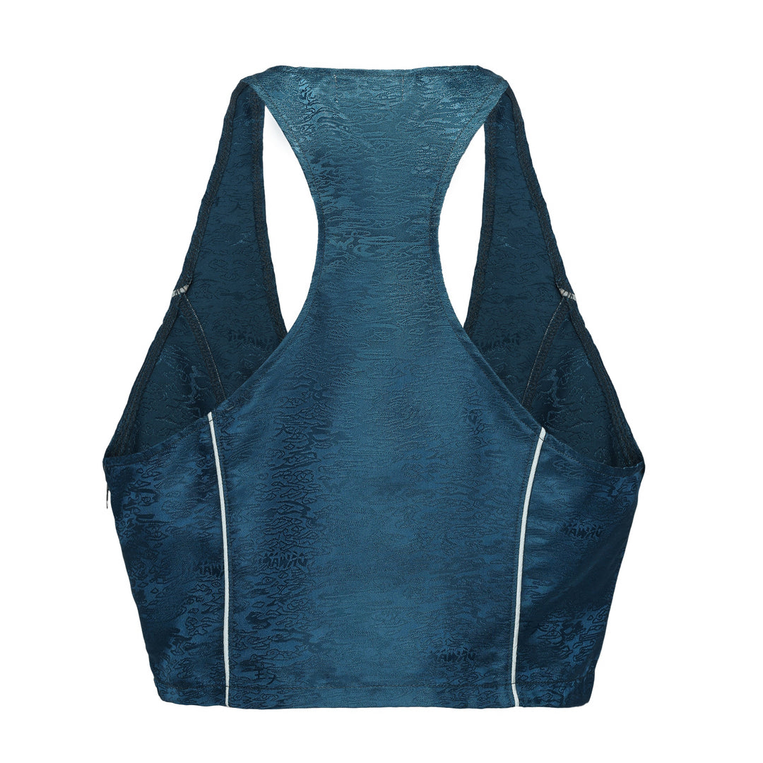 Forest blue sleeveless crop top, back view with wide arm openings and white piping