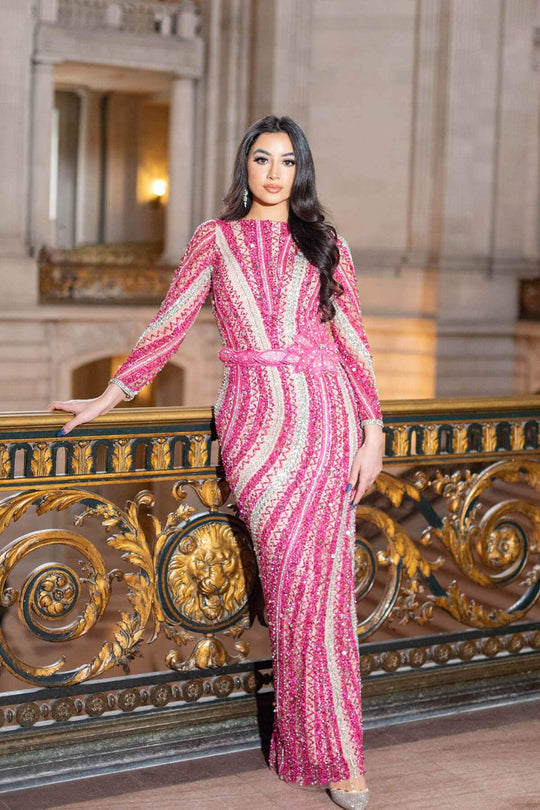 Fuchsia beaded long-sleeve maxi dress with pink-and-white stripe pattern and tied waist