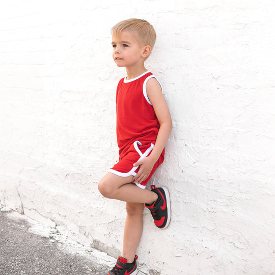Red ribbed track shorts set with white trim, sleeveless top and pull-on shorts