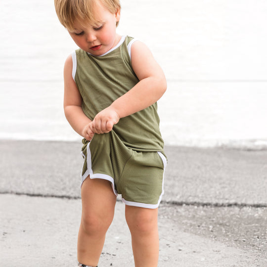 Sage track shorts set with sleeveless top; shorts with white-lined tie