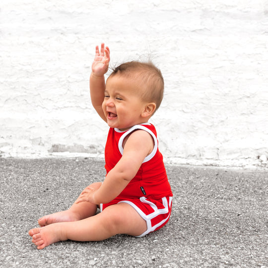 Red sleeveless top and shorts set with white trim, soft ribbed fabric