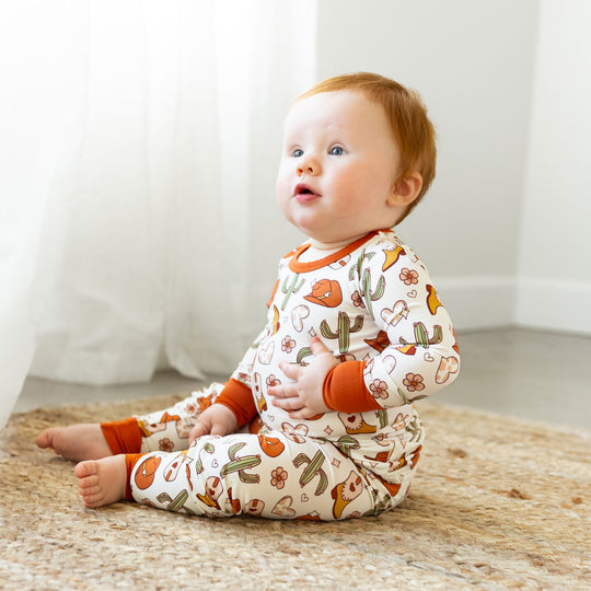 LONG SLEEVE 2 PIECE SETS baby outfit, white base with orange cuffs; cactus print