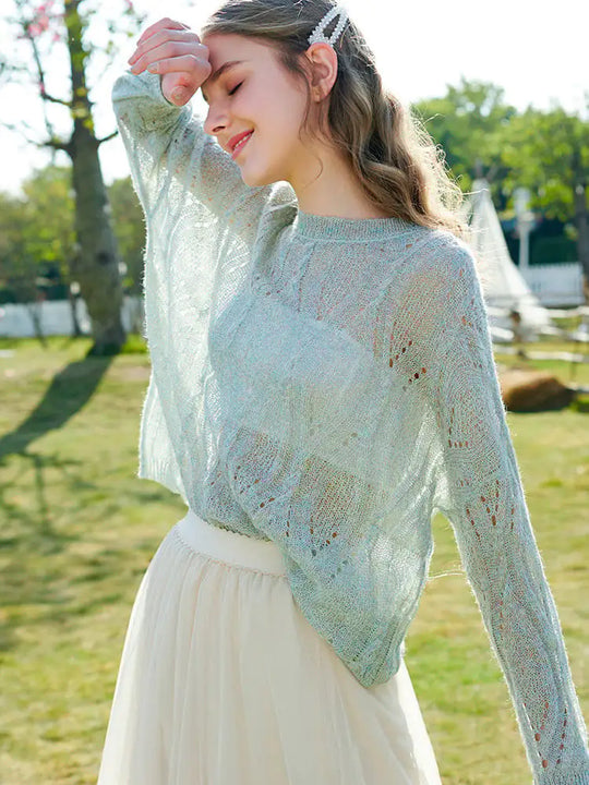 Light blue hollow knit pullover sweater with textured openwork and relaxed fit