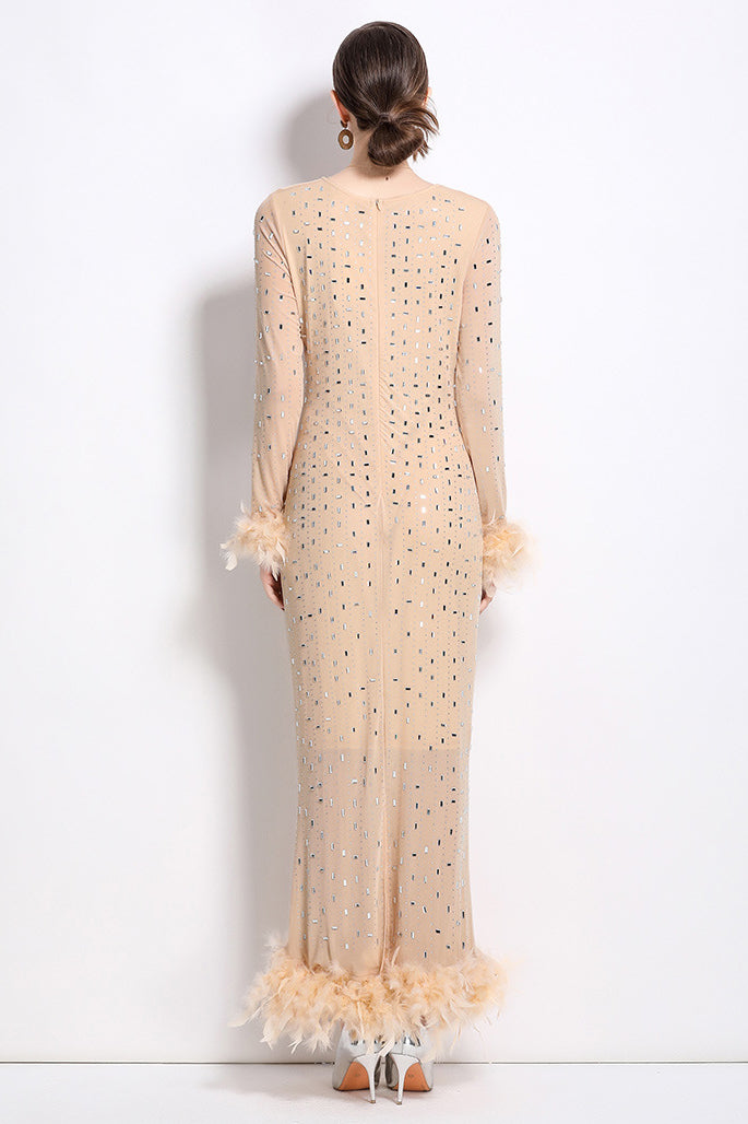 Beige long maxi dress back with centered seam, dot embellishment and feather trim