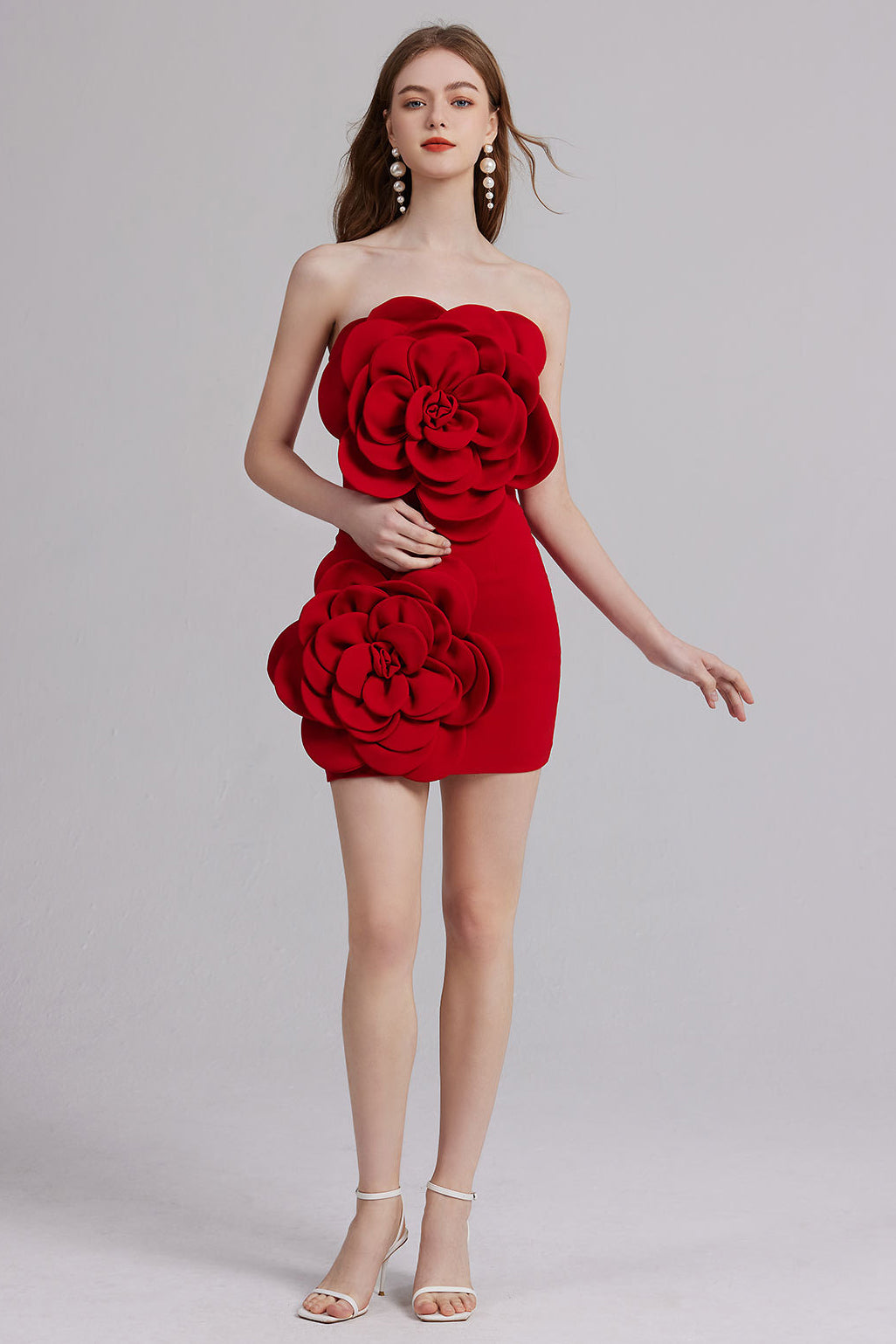 Red strapless mini dress with large rose appliqué at bust and waist