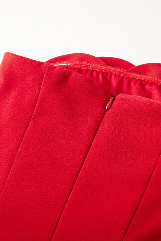 Red dress fabric seam with visible zipper trim
