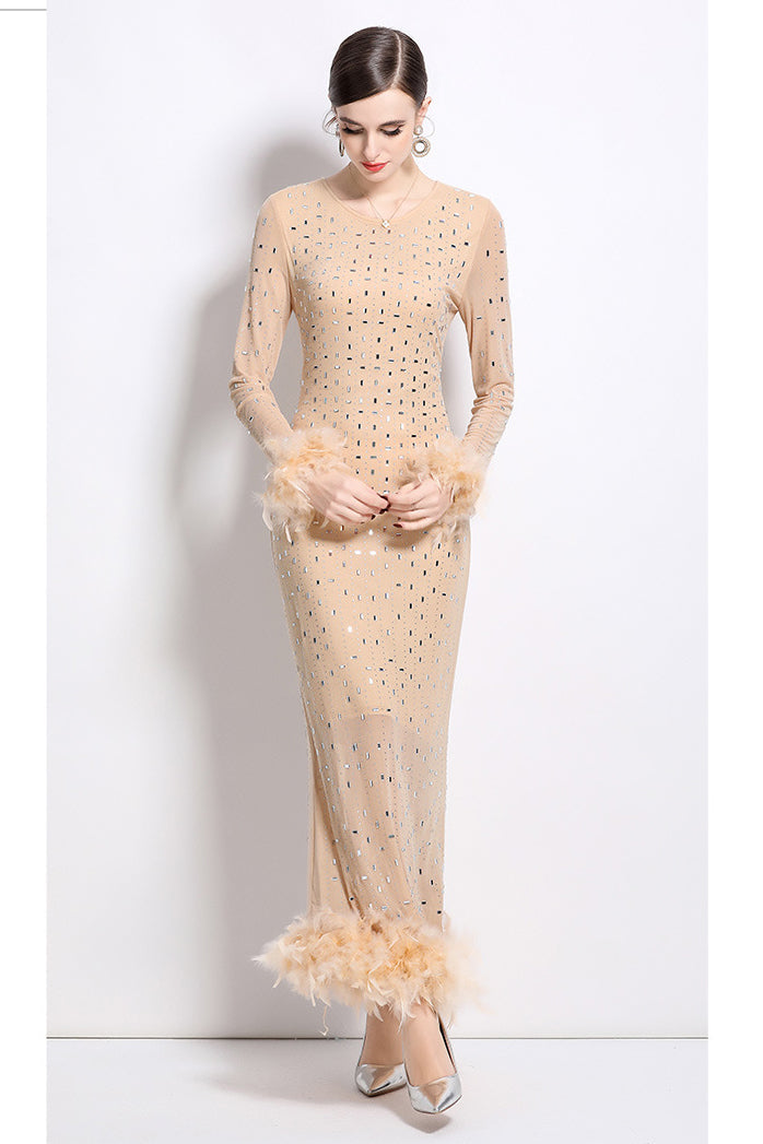 Beige fitted maxi party dress with long sleeves, feather cuffs and hem, dotted allover