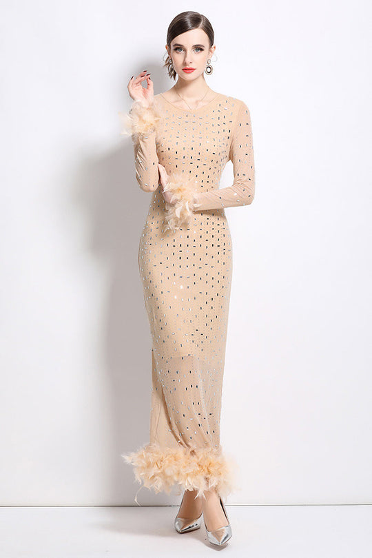 Beige fitted maxi dress with long sleeves and feathered cuffs, dot pattern throughout