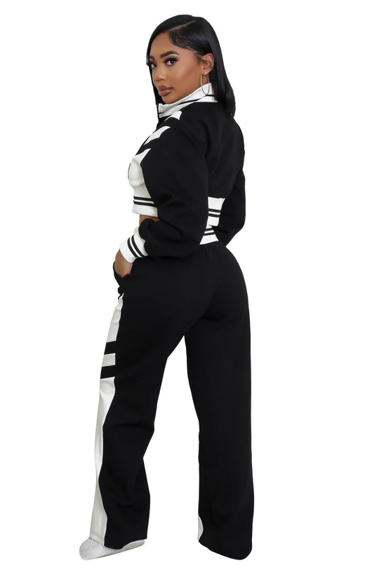 Black two-piece set side view: striped cropped jacket and wide-leg pants