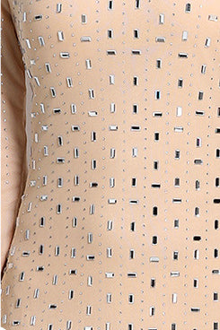 Beige fabric close-up with tiny dark dots and subtle shimmer