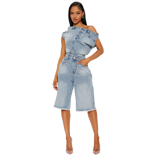 Blue denim romper, off-shoulder neckline, button fly and wide cropped legs