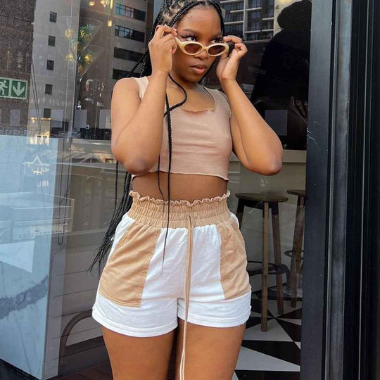 Beige and white shorts with elastic waist and contrasting side panels