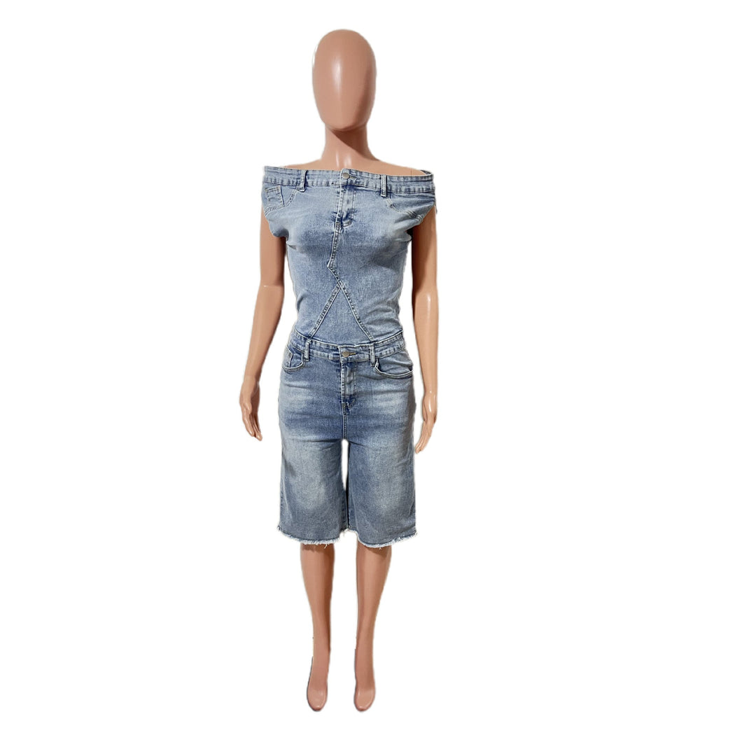 Blue denim romper front view on mannequin with off-shoulder detail and cropped fit
