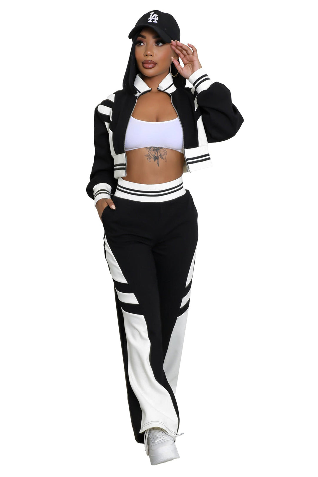 Black zip-up jacket and matching wide-leg pants with bold white stripe panels