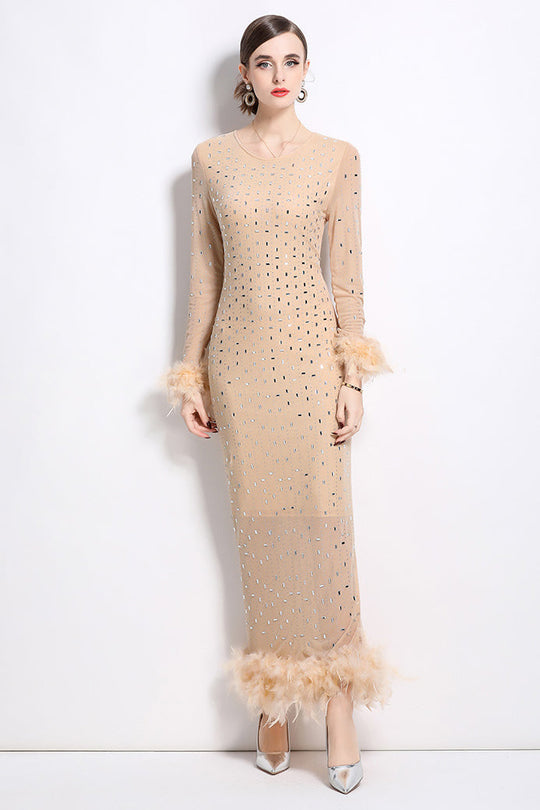 Beige long maxi dress with dot embellishment and feathered hem detail