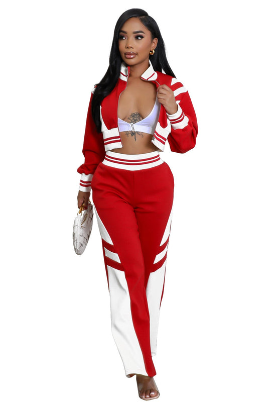 Red zip-front crop jacket with white striped trim and matching flared pants