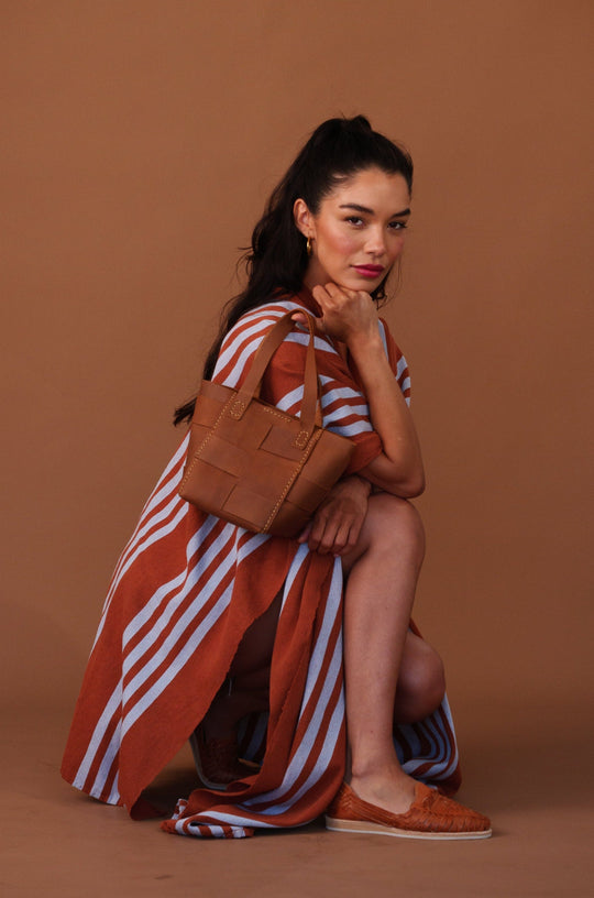 Camel mini basket bag with short handles and front flap detail