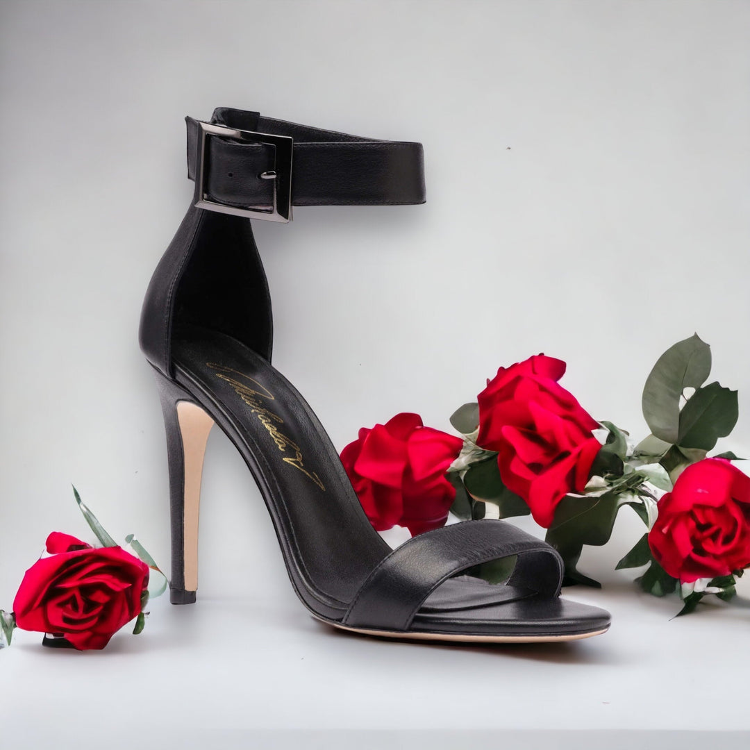 Black heeled sandal with wide ankle strap and square buckle