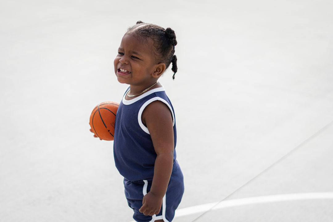Navy track shorts set with white-trim sleeveless tank and matching shorts