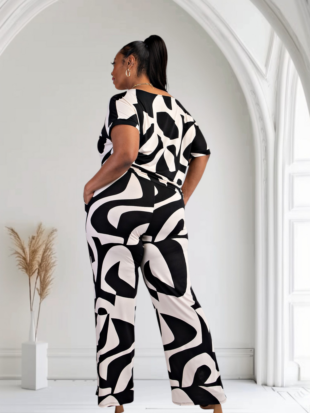 Matching plus-size pants set, back view: black and white abstract print