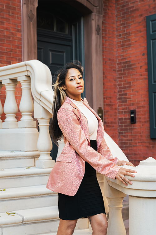 Blush blazer on model, patterned jacket with gold-button closure and tailored length
