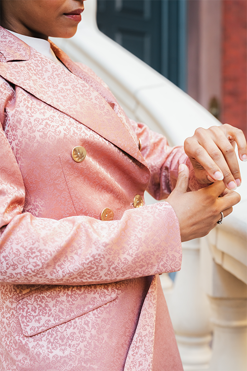 Blush double-breasted blazer detail with gold buttons and patterned fabric