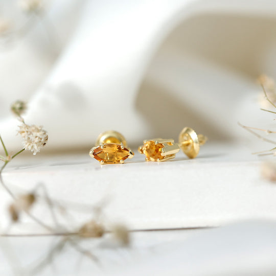 Pair of marquise citrine stud earrings with gold-tone settings