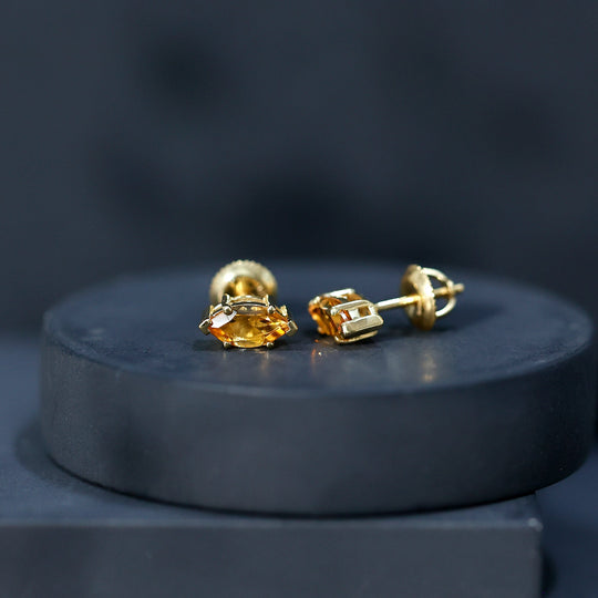 Citrine stud earrings, gold-tone screw-back style, side view