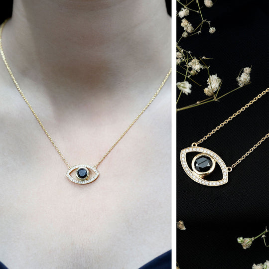 Evil eye necklace pendant with dark center stone and sparkling white pavé edge