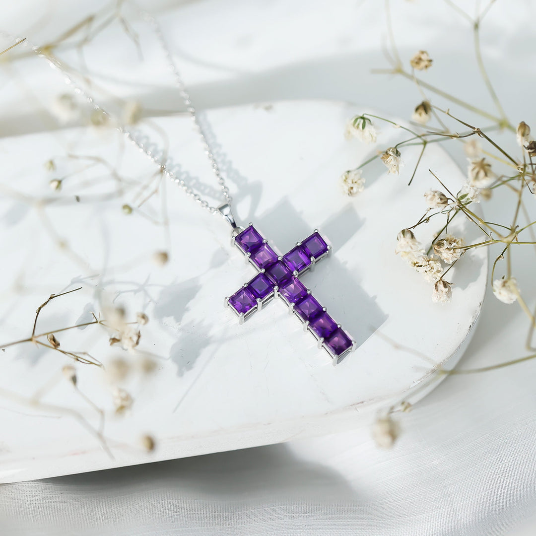 Purple amethyst cross pendant on silver chain with prong-set square gemstones