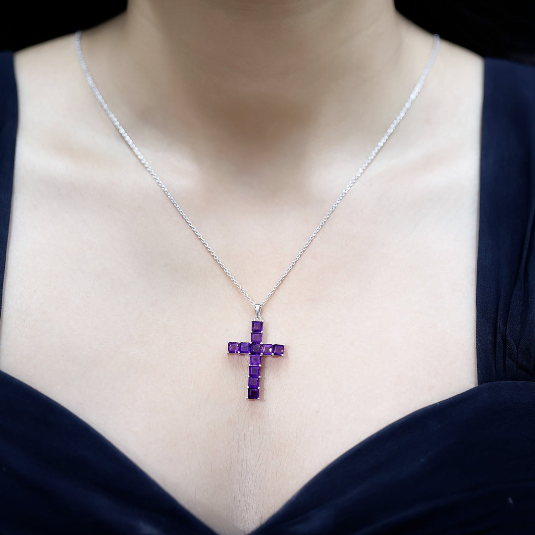 Amethyst cross pendant necklace with purple princess-cut stones and silver chain