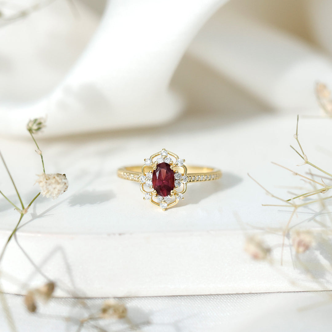 Oval rhodolite diamond halo ring, gold-toned band with pave accents