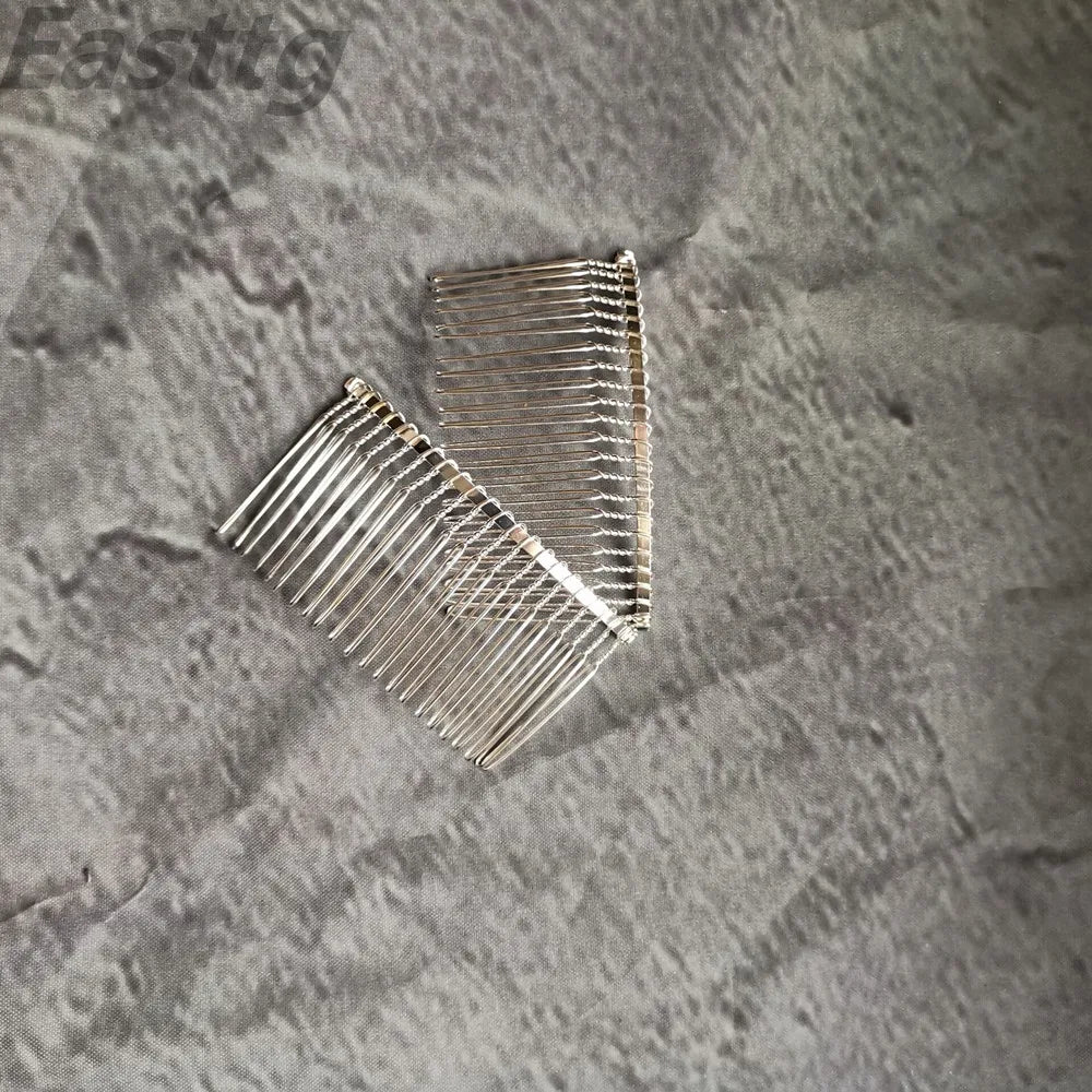 Silver-tone comb with rows of teeth to secure the bridal veil