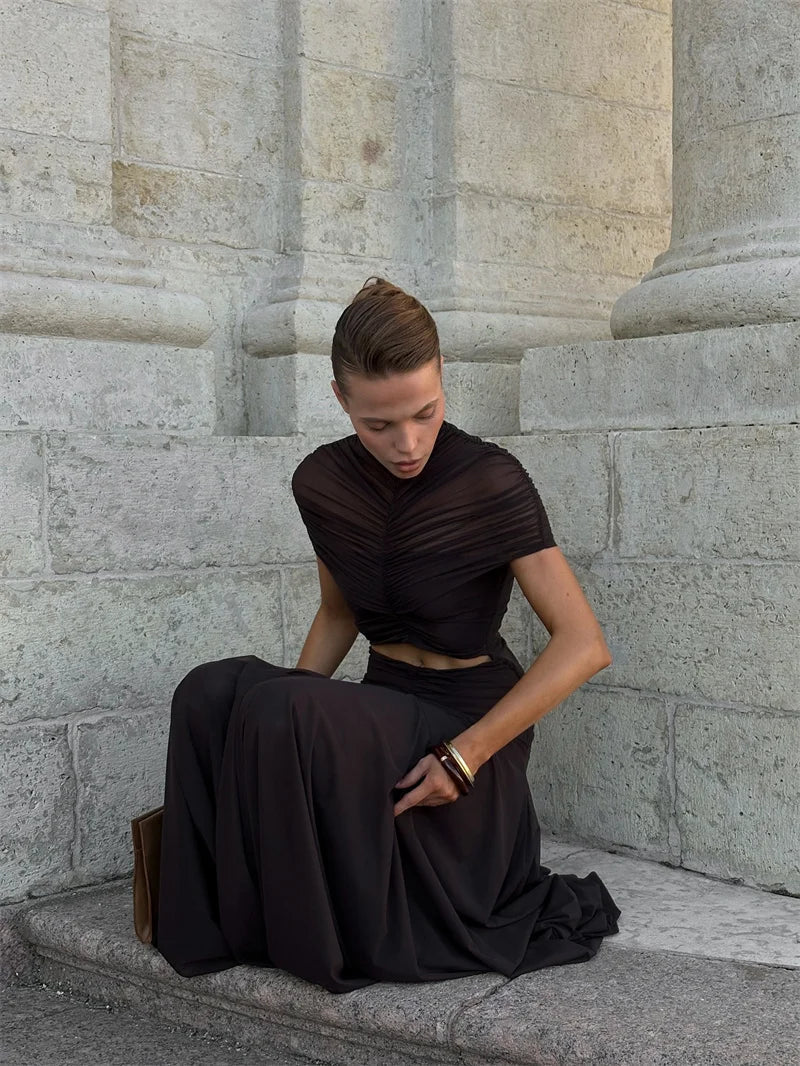 Black maxi dress, short sleeves; draped waist knot detail