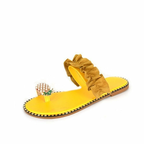 Yellow flat slide sandals with pearl pineapple ornament, tan beaded sole trim, fabric bow
