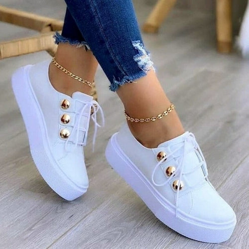 White lace-up vulcanized casual sneakers with gold button eyelets and white laces