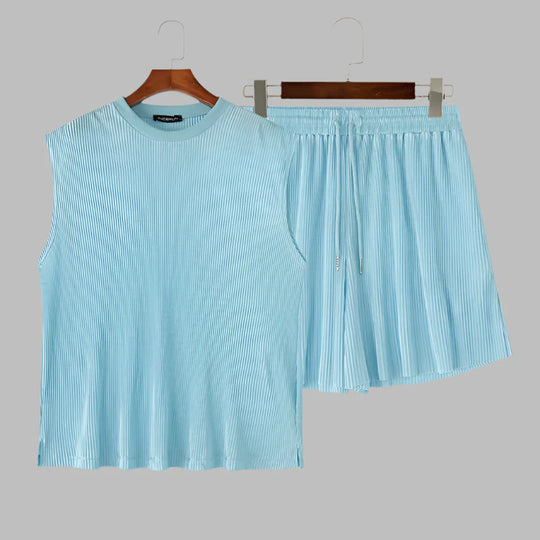 Light blue ribbed sleeveless tank and pleated shorts set on hangers