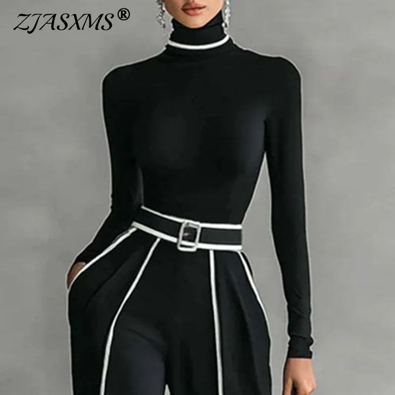 Black mock-neck top with stand collar and belt; wide-leg trousers with white stripe trim