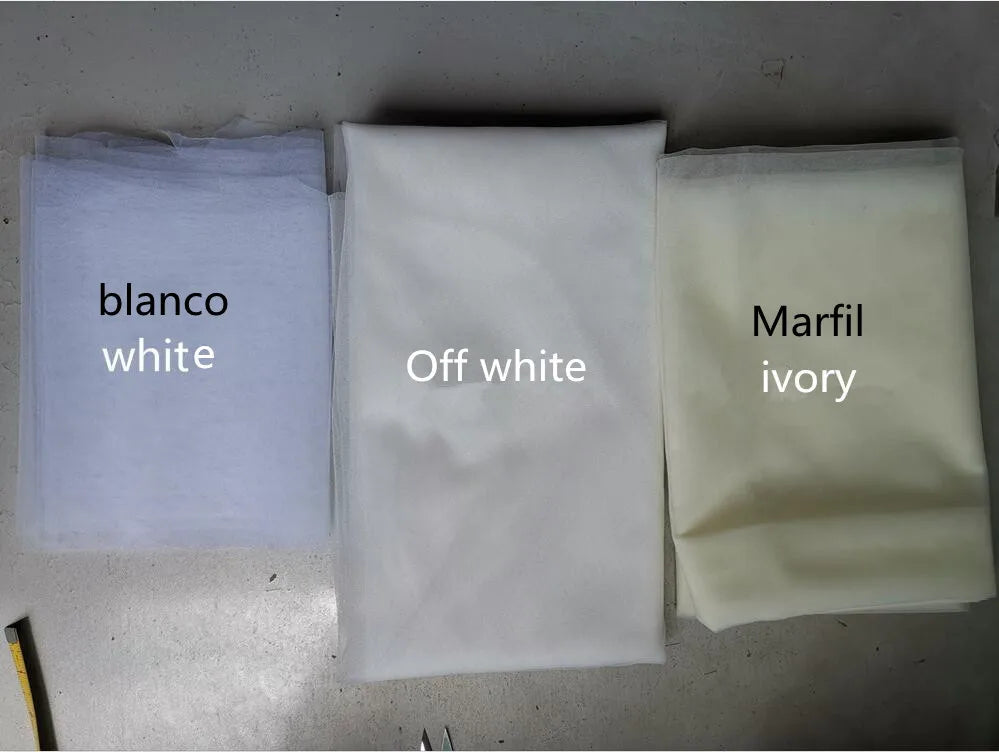 Veil color options: white, off-white, and ivory in sealed fabric bags
