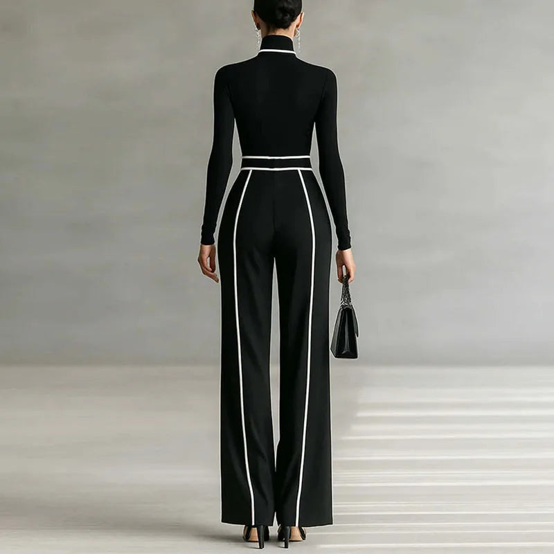 Black back view: mock-neck long-sleeve top and wide-leg trousers with white piping stripes