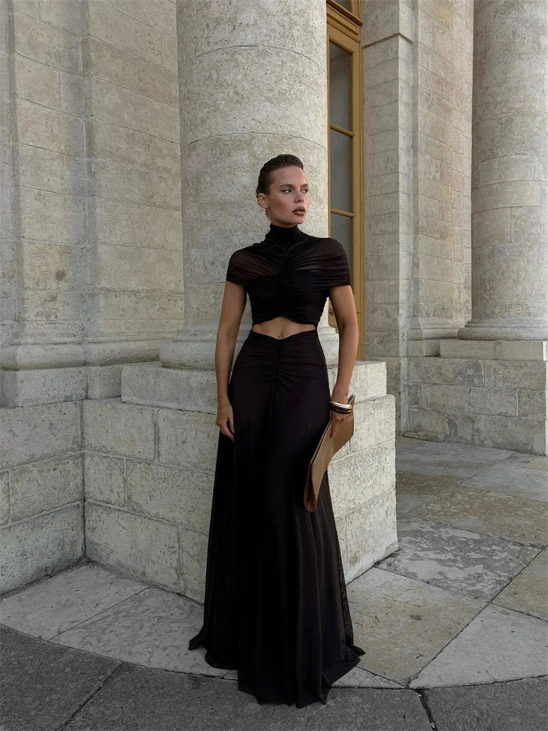 Black high-waist maxi dress with short sleeves; ruched wrap-style bodice