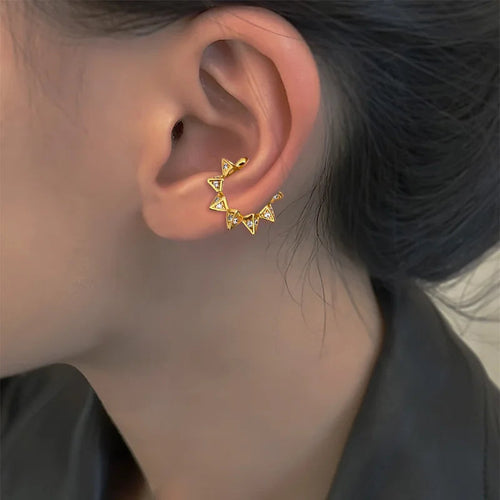 Gold tone star geometric ear cuff earring with X-shaped drops