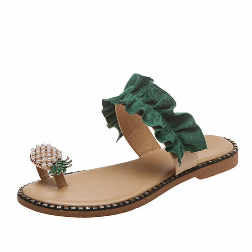 Green pineapple pearl flat slides with ruffled upper and open toe, brown base