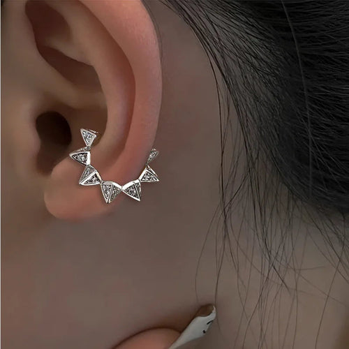 Silver tone star motif ear cuff earring with connected triangular stones