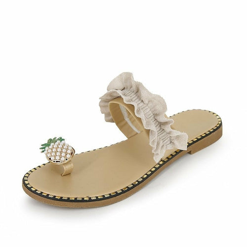 Light beige flat slide sandal with pineapple pearl charm and wide ruffled top strap