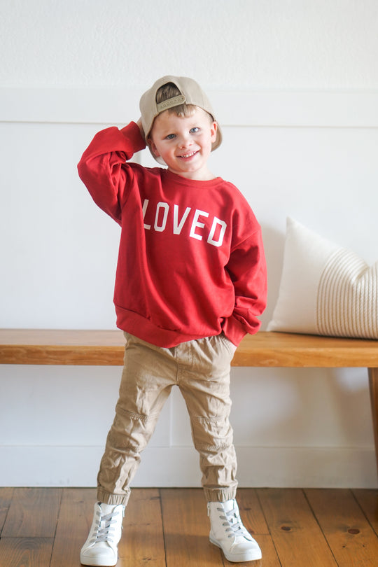 Red crewneck sweatshirt with &
